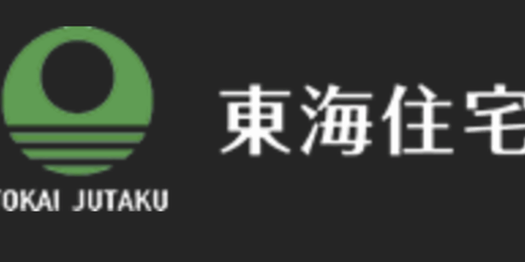 東海住宅のロゴマーク—黒背景に緑のシンボルと白文字が並ぶ